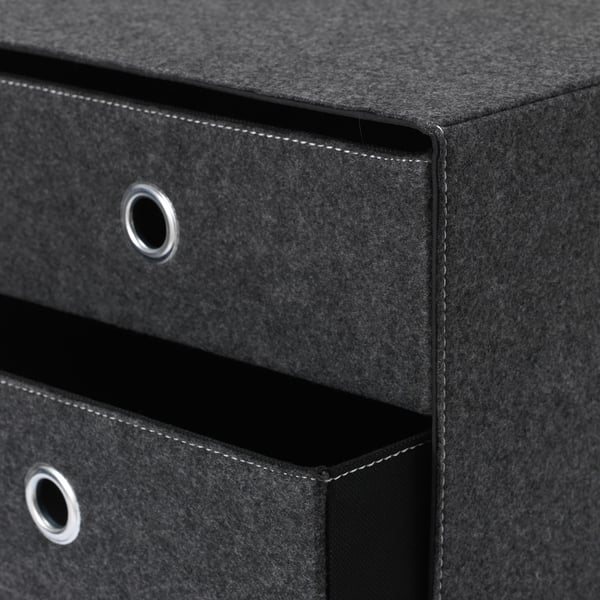 Black fabric storage box with metal handles, stitched edges, and folded top.