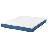 Depicts a BLÅFJÄLLET mattress in blue. It a foam top layer and pocket springs for support, encased in a white and blue cover.
