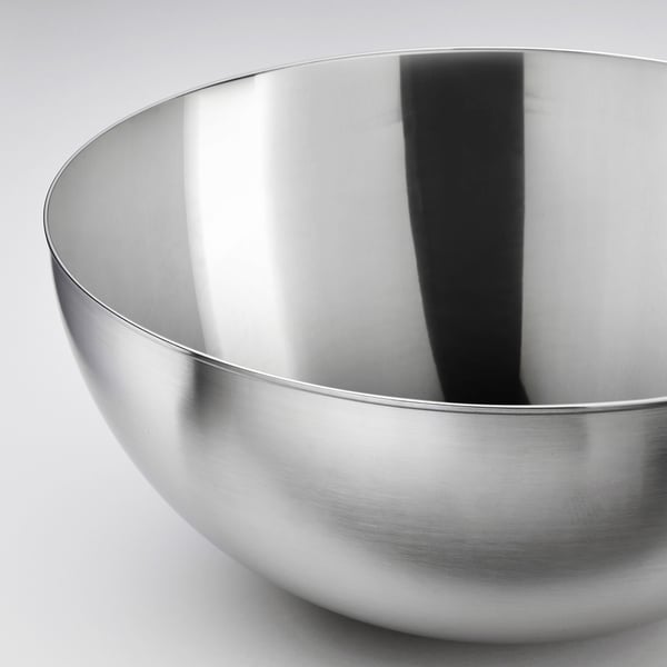 Shiny stainless-steel bowl; smooth, reflective surface; deep, rounded shape.