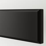 Black drawer front with smooth, lacquered surface and beveled edges, showcasing sleek design and quality finish.