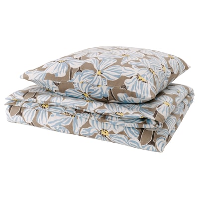 Folded floral bedding, BÖNTRÄD, light blue and beige, soft square shapes, 100% recycled cotton.