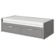 The BRIMNES gray day-bed converts into a guest bed with drawers for storage.