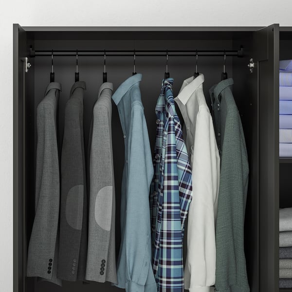 A black wardrobe with mirrored door displaying a clothes rail and hanging shirts.
