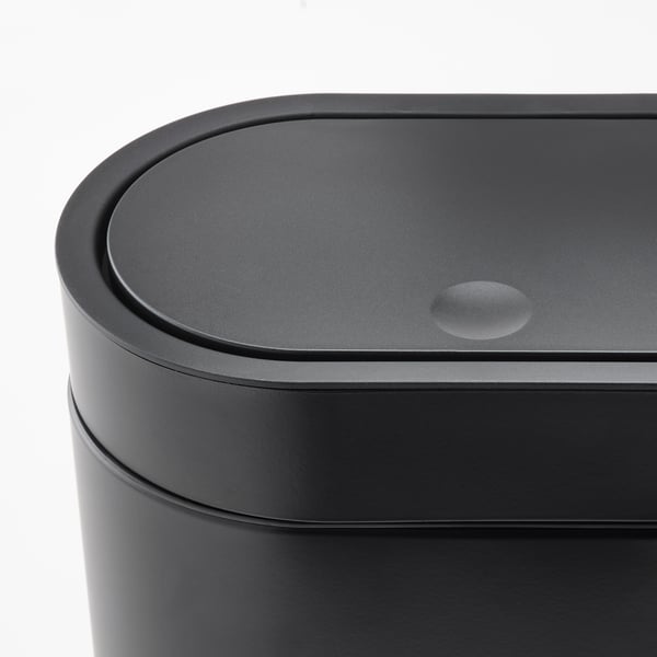 Modern black cylindrical trash bin with sleek, touch-open lid, showcasing high-quality materials and design.