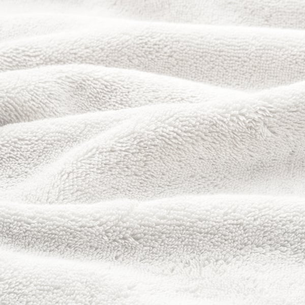 Soft organic cotton towels, plush and textured, folded neatly.