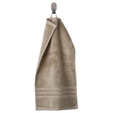 BROKGLIM gray towel with ribbed texture and striped border hangs neatly on a hook.