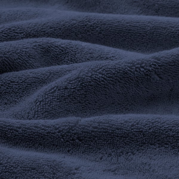 Soft, textured navy blue organic towels showcasing plush, absorbing weave.