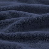 Soft, textured navy blue organic towels showcasing plush, absorbing weave.