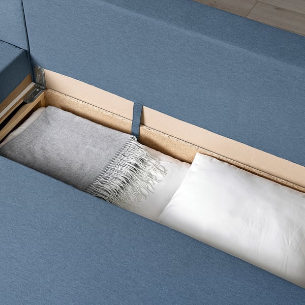 Sofa-bed reveals storage.