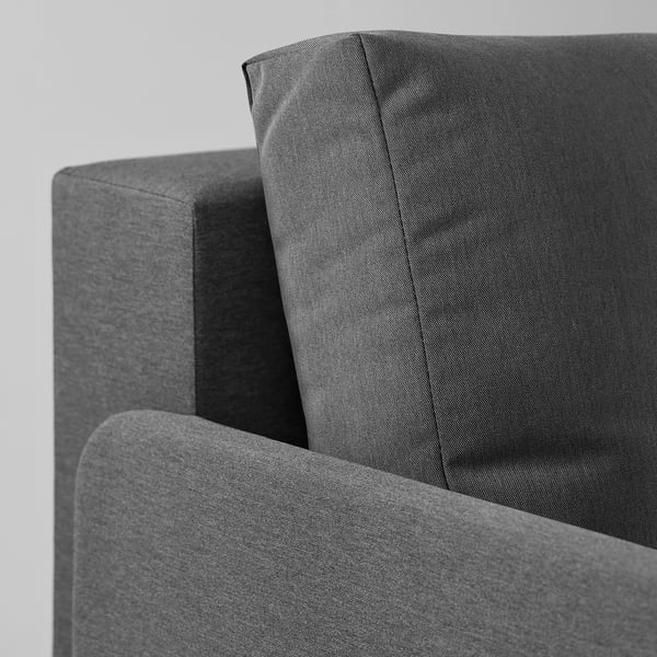 Grey l-shaped sofa-bed corner with sleek, durable fabric and cushioned armrests; part of BRUKSVARA series.