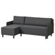 A dark grey BRUKSVARA l-shaped sofa-bed. It has a modern design with tapered black legs, and built-in storage for convenience.