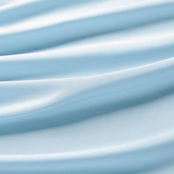 Blue recycled polyester fitted sheet, close-up texture.