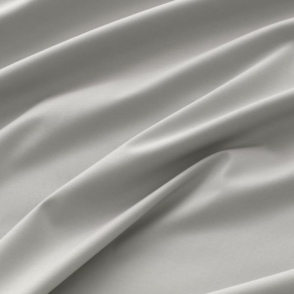Close-up of luxurious, textured fabric; smooth, elegant weave; likely a high-quality curtain.
