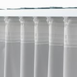 This image shows a white, room-darkening curtain with tabs for hanging. It blocks light and provides privacy.