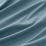 Close-up of textured, triple-weave fabric showcasing intricate, linear patterns and soft, neutral hue, depicting a premium, room-darkening curtain.