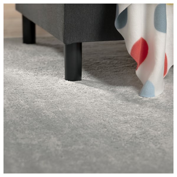 Close-up of grey BRUKSVARA rug, soft texture, modern style, synthetic fibers.
