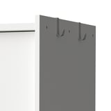 Wardrobe with hooks and railing for hanging clothes.