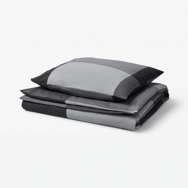 A grey BRUNKRISSLA duvet cover and pillowcase set, featuring a striped design with cotton/viscose blend fabric.