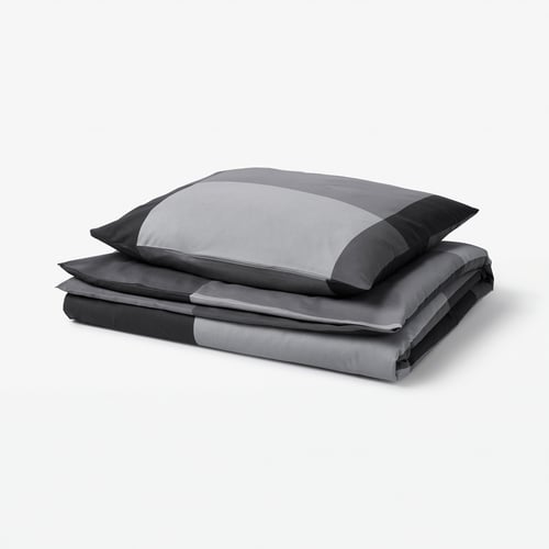 A grey BRUNKRISSLA duvet cover and pillowcase set, featuring a striped design with cotton/viscose blend fabric.