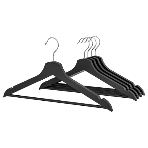 Five black wooden hangers with chrome hooks, neatly stacked, designed for organising clothes.