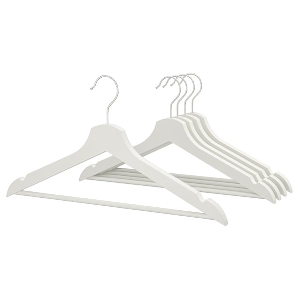 Six light-colored wooden hangers with chrome hooks arranged neatly, designed to keep clothes organized.