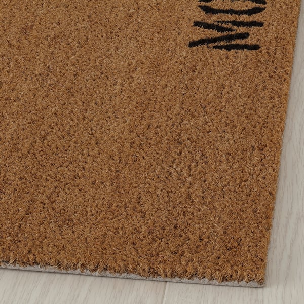 Natural doormat with bold text, high-quality coir, firm backing.