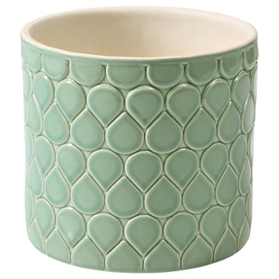 Green ceramic planter, round, textured leaves.