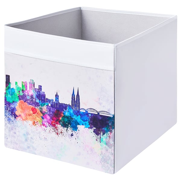 DRÖNA box, white with colorful cityscape design, square shape, folding handles, recycled polyester and polypropylene.
