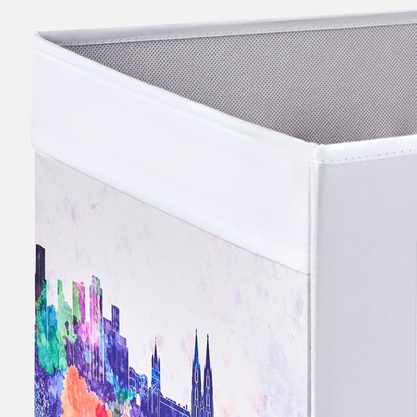 Foldable storage box with vibrant city print. Made from recycled materials. Handle on two sides for easy access.