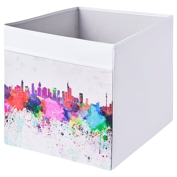 White DRÖNA storage box with colorful city skyline design, square shape, and mesh top.