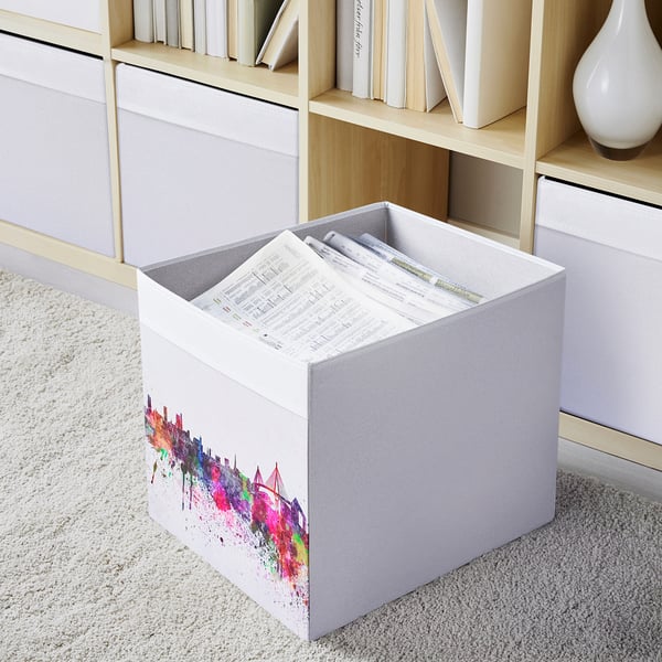 DRÖNA white storage box with colorful design. Holds papers, fits kallax shelves. Made from recycled polyester.