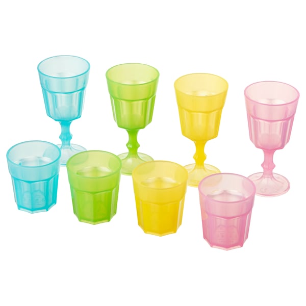 A set of colorful plastic cups and goblets for kids, including blue, green, yellow, and pink in square and stemmed shapes.