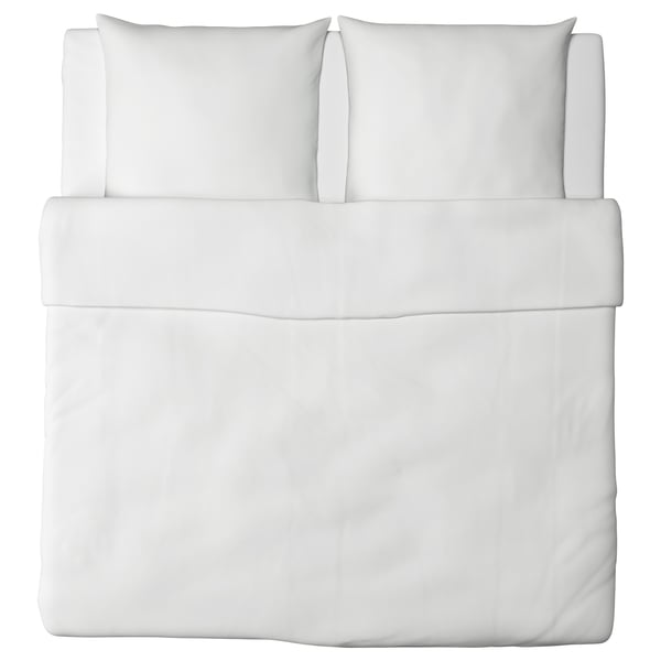 White bed set with clean lines, made of soft cotton. Includes fitted sheet, flat sheet, and two pillowcases.