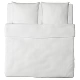 White bed set with clean lines, made of soft cotton. Includes fitted sheet, flat sheet, and two pillowcases.