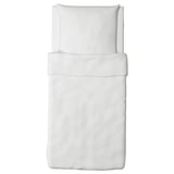 White bedding set with pillow and duvet, simple and minimalist design, made of soft cotton.