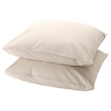 Two beige DVALA cotton pillowcases, soft and rectangular, stacked neatly.