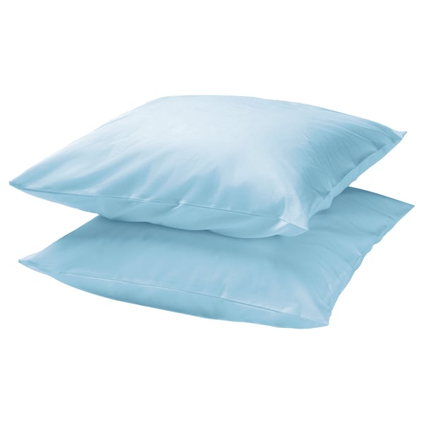 Two sky-blue DVALA pillows stacked, rectangular shape, smooth satin finish, 100% cotton.