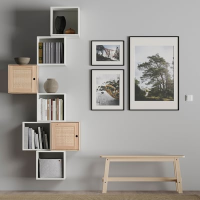 EKET wall shelf with decorative items, books & photos.