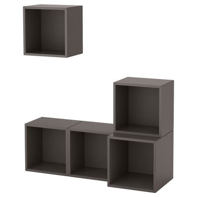 Black modular wall-mounted cube shelves. Five interconnected gray cuboidal units.