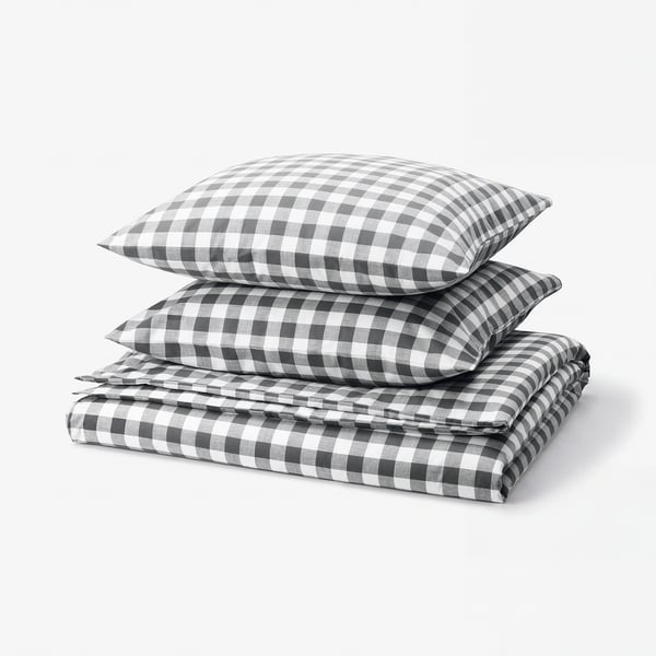 Elegant chequered duvet and pillow set in grey and white, crafted from soft organic cotton.