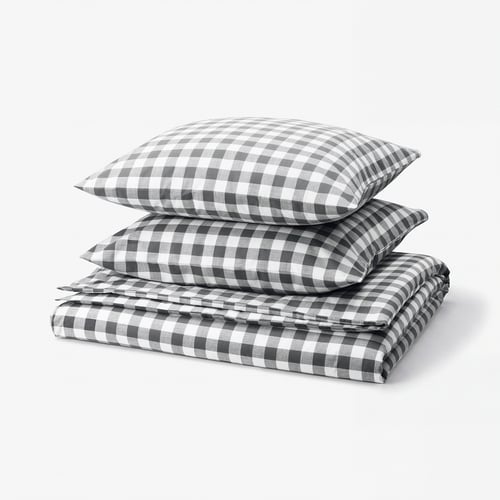 Elegant chequered duvet and pillow set in grey and white, crafted from soft organic cotton.