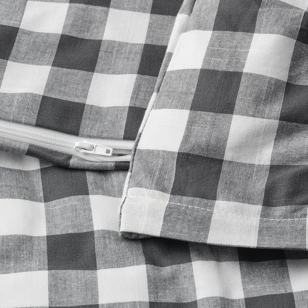Checkered duvet cover with zipper closure in black and white.