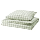 A neatly folded pale green and white checkered duvet cover set made of organic cotton. It includes a duvet cover and pillowcase with a zipper design.