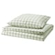 A neatly folded pale green and white checkered duvet cover set made of organic cotton. It includes a duvet cover and pillowcase with a zipper design.