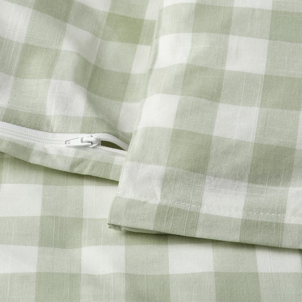 A light green and white checkered duvet cover with a visible zipper closure. Part of an organic cotton bedding set.
