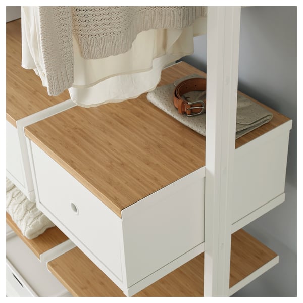 Modular storage unit with adjustable shelves & drawers, bamboo top, white frame. Belt & wallet shown on shelf.