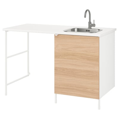 Modern white and wood counter unit with sink, stainless steel faucet, and storage.