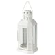 White octagonal ENRUM lantern with cutouts, steel & glass, warm glow, indoor/outdoor.