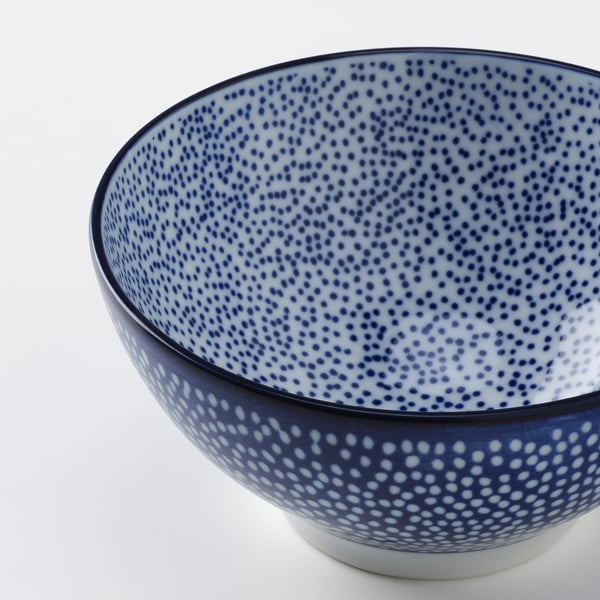 Blue-spotted bowl with dark blue rim.