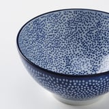 Blue-spotted bowl with dark blue rim.